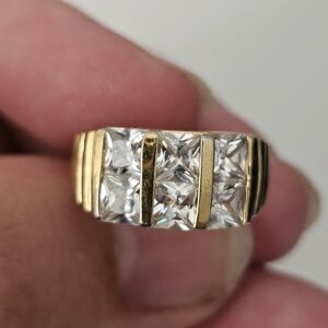 EDCO Gold Three-Stone Ring with Channel-Set Details